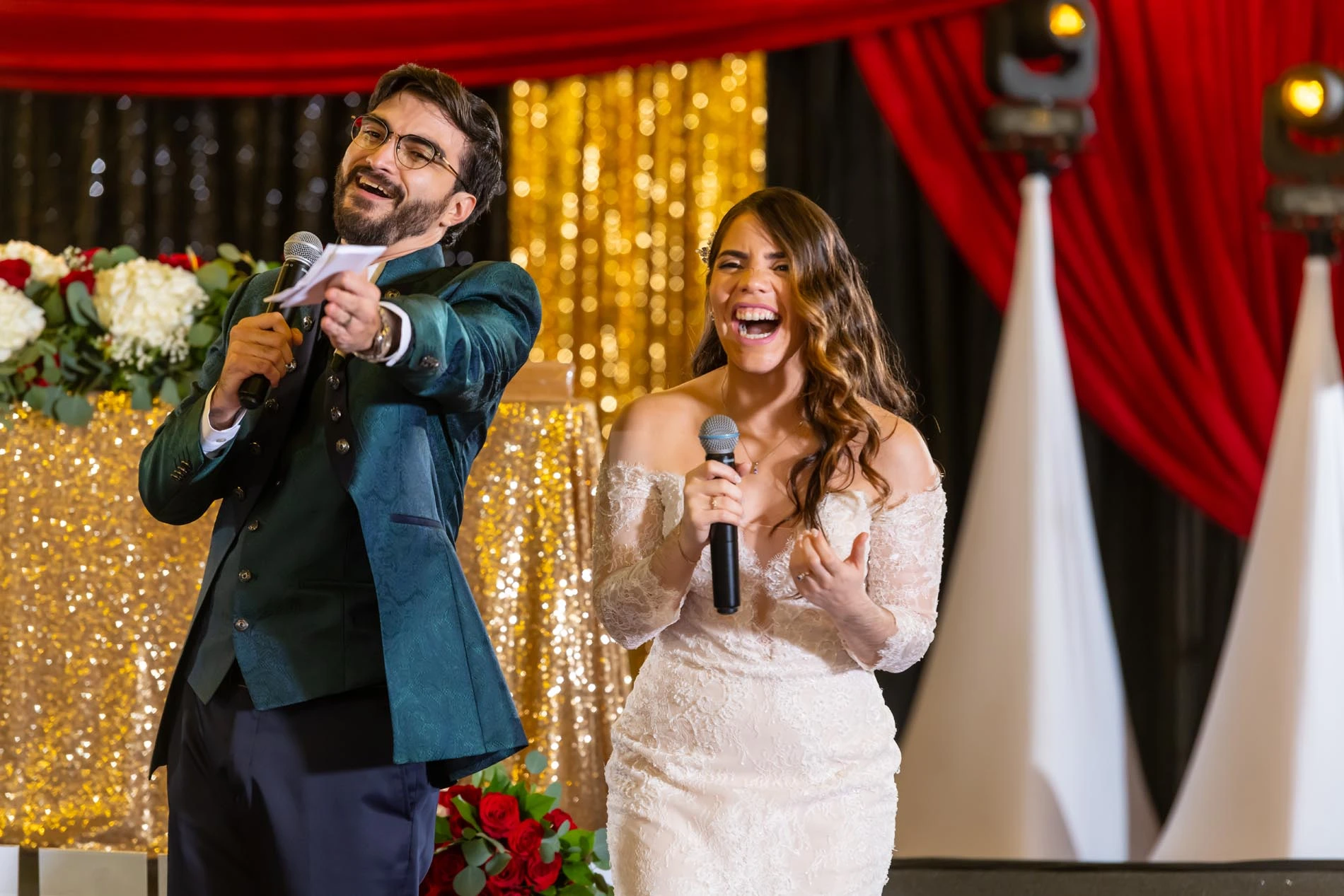 Happy newlyweds laughing after giving out some "awards" to guests