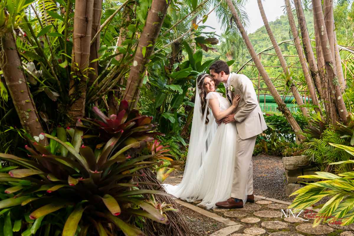 Wedding couple surrounded by green nature
