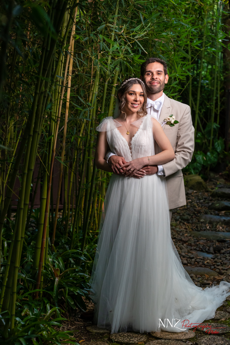 Wedding couple in front of bamboo
