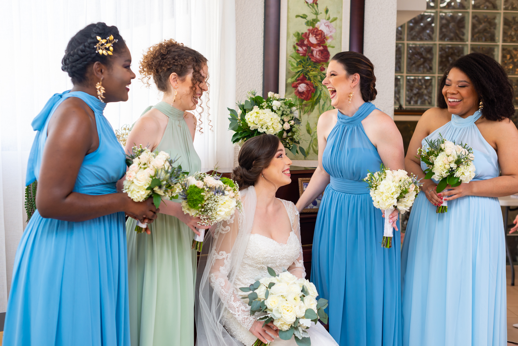 Bride and bridesmaids can't contain laugh