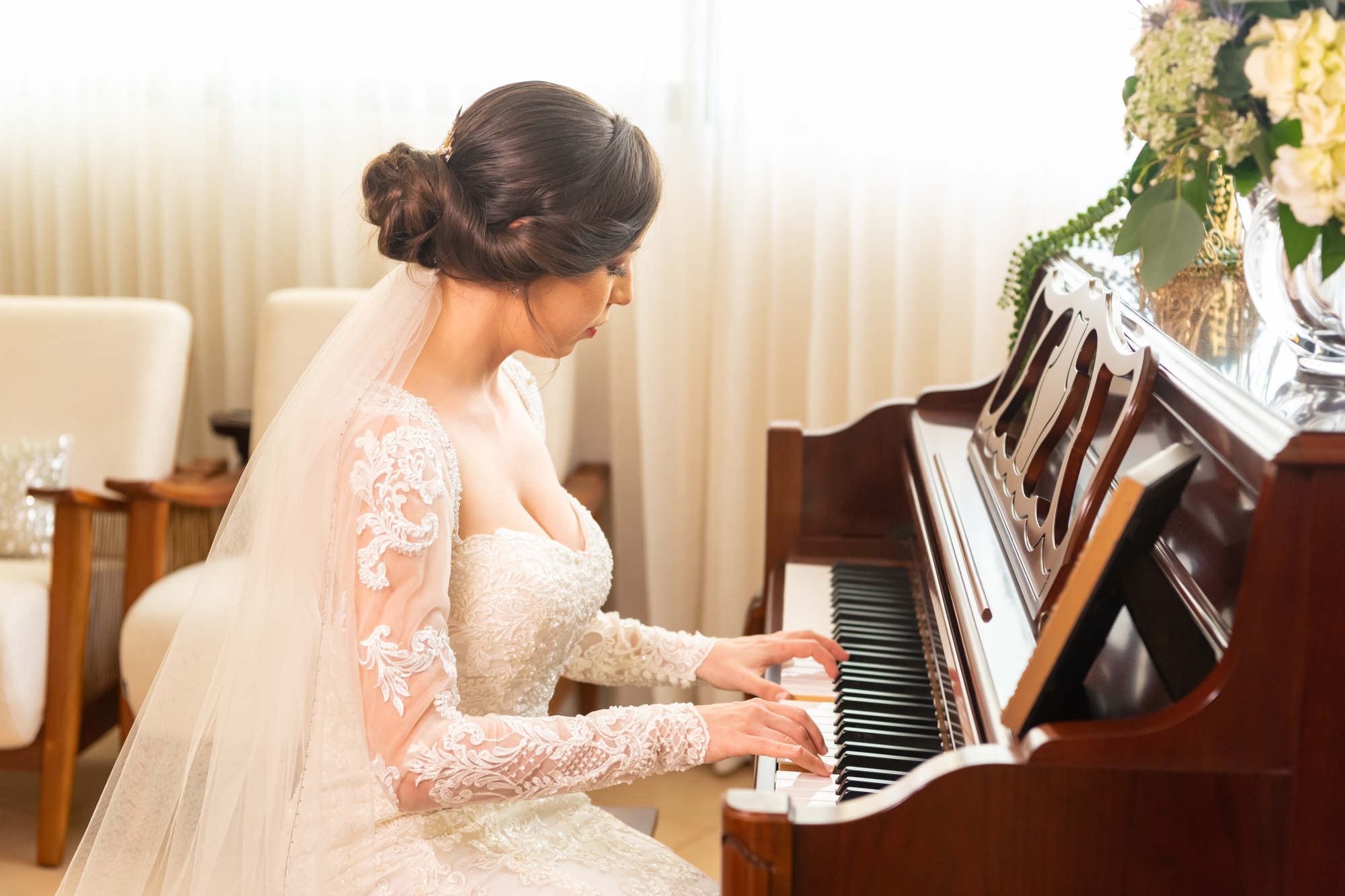 Bride playing the piano before leaving her home