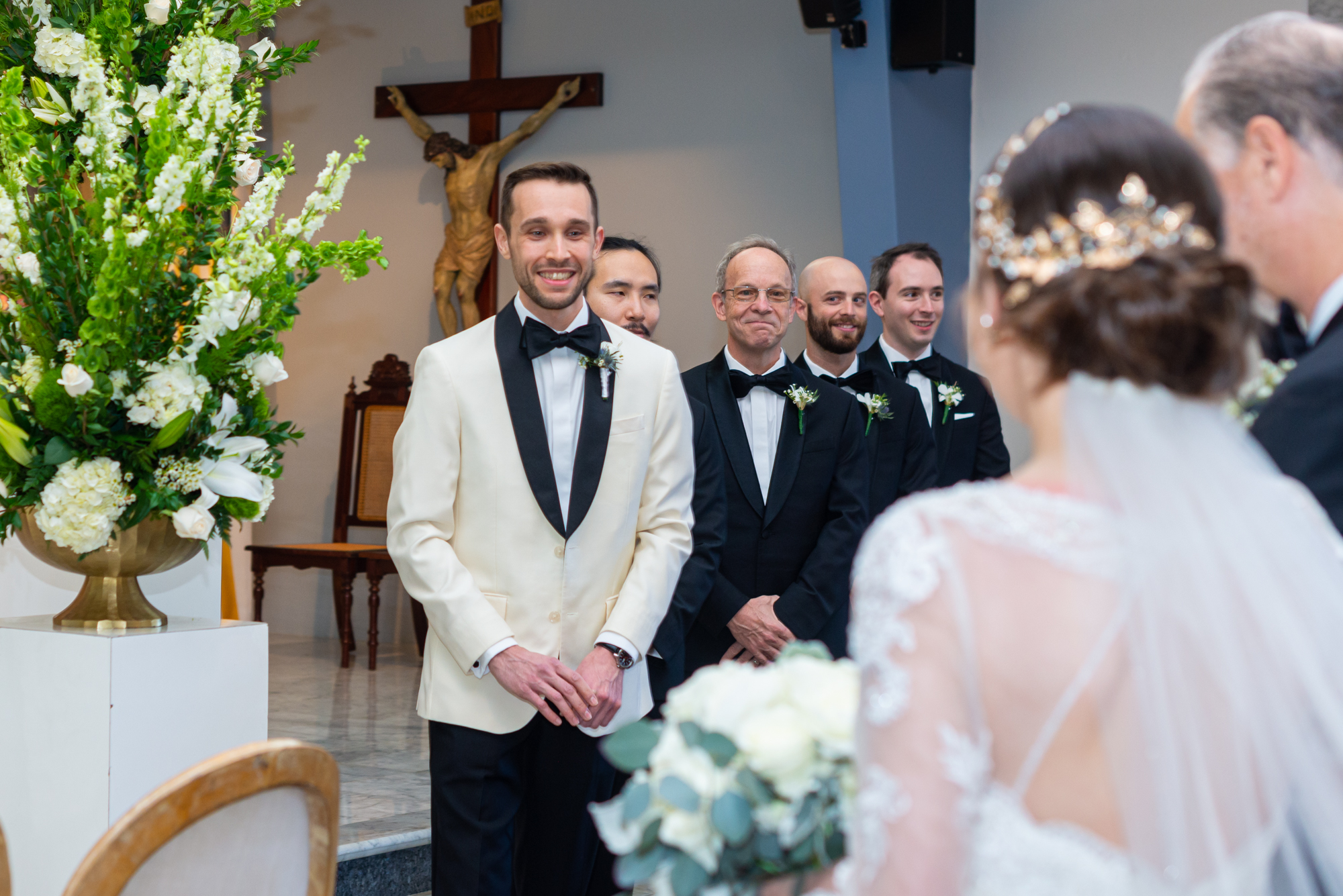 Groom looking at her fiancée in front of altar