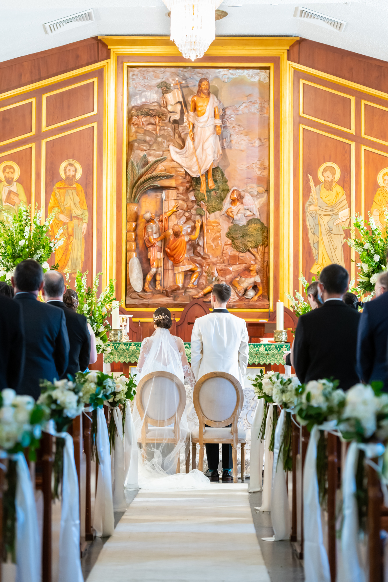 Back view of couple in front of altar