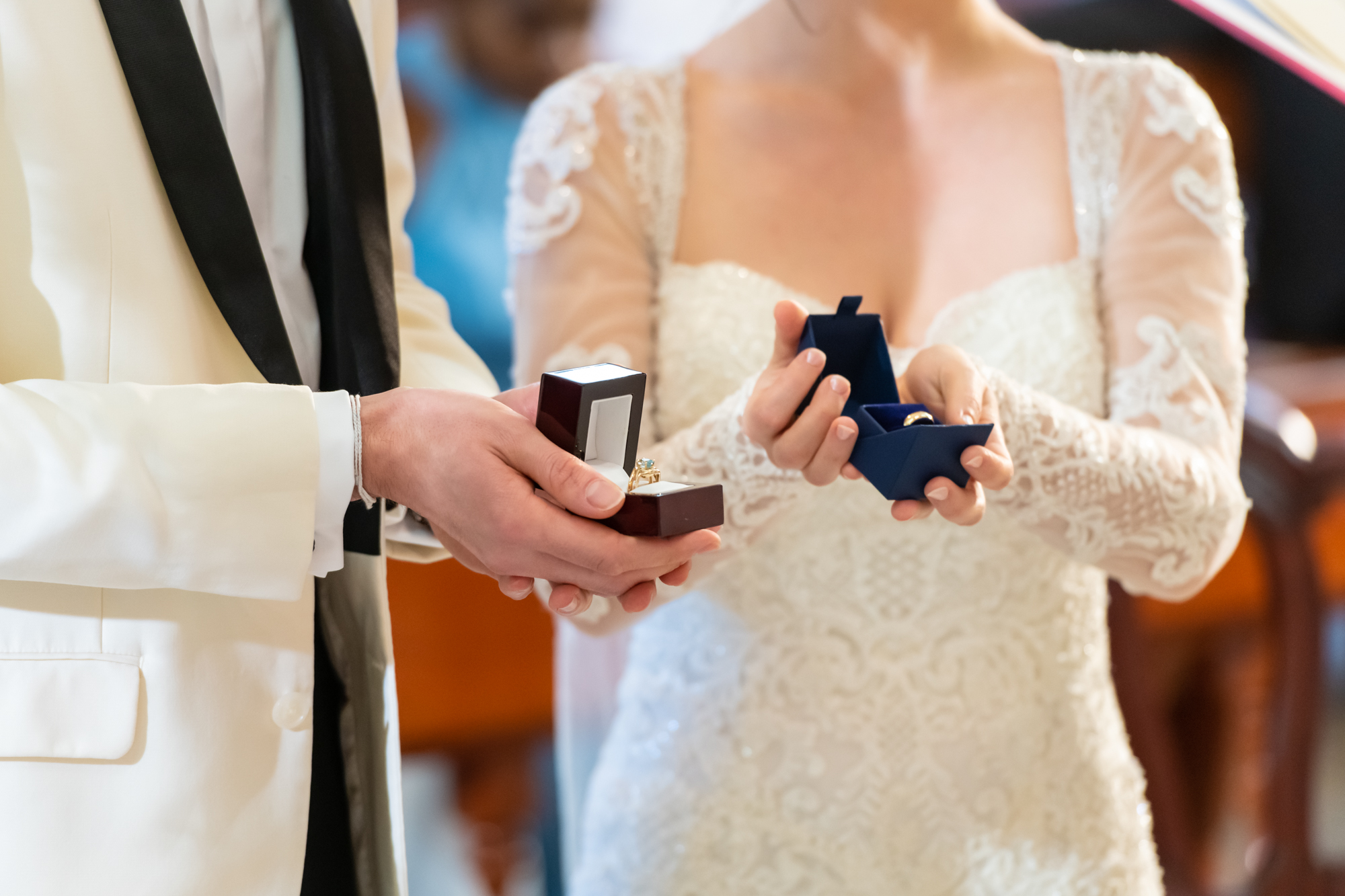 Bride and groom holding the wedding rings
