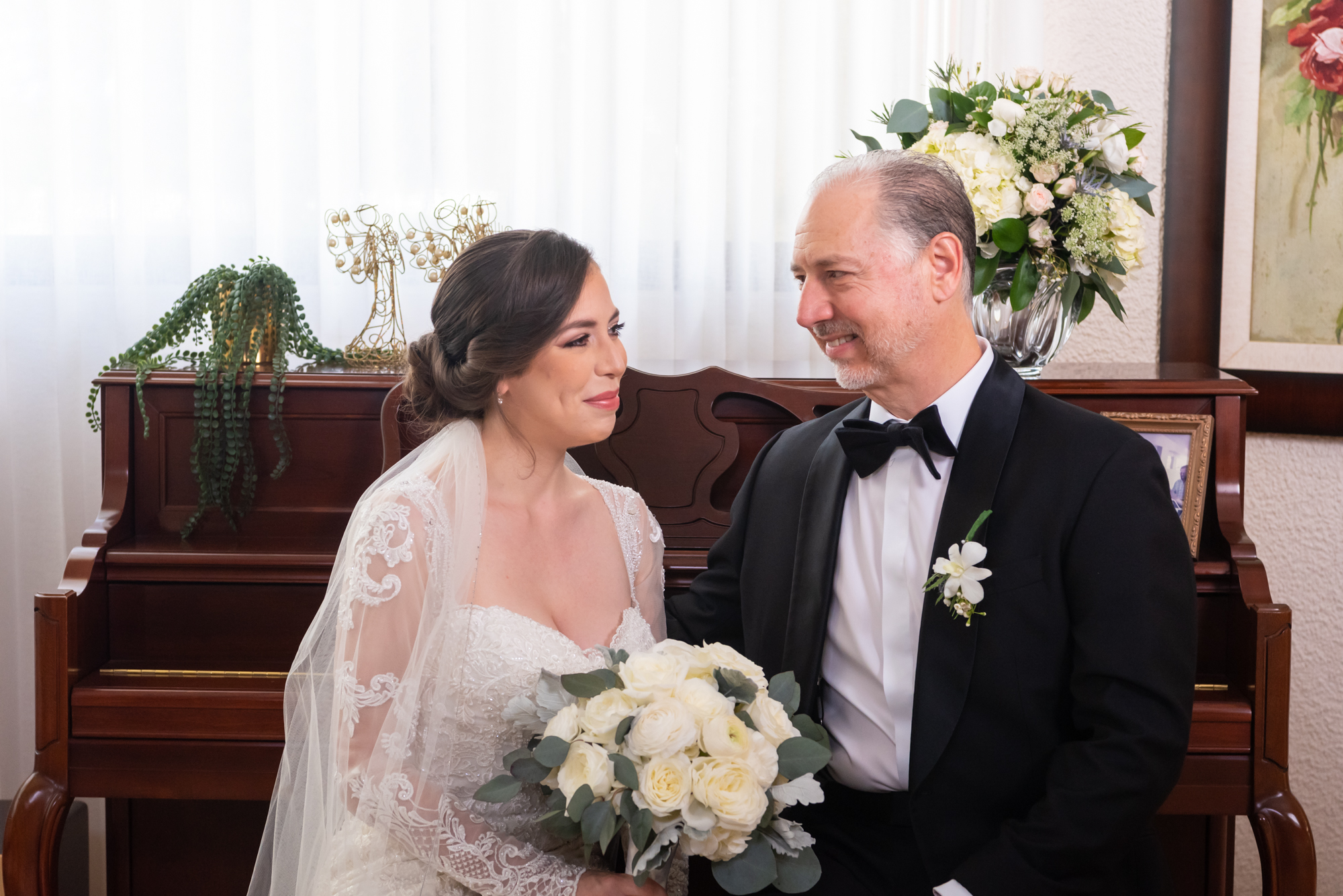 Bride and her dad looking at each other